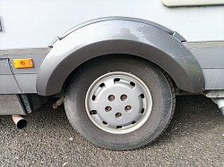 Rear left wheel arch freshly painted.