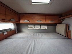 Rear fixed double bed above garage.
